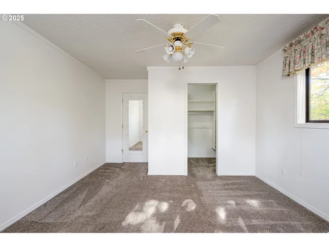 a bathroom with a sink a toilet and a window