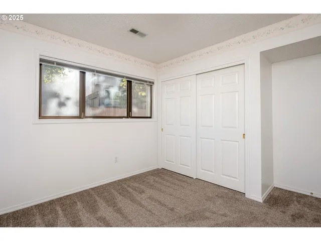 a utility room with closet dryer and washer