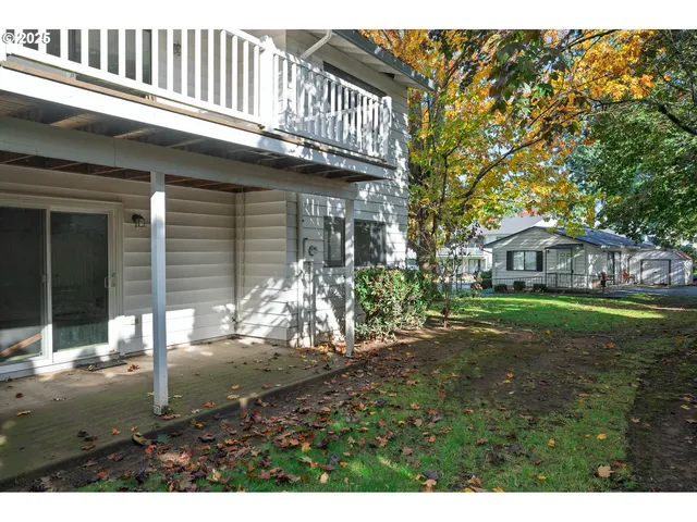 a view of a house with a backyard porch and sitting area