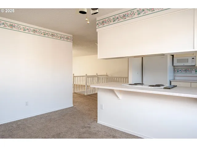 a kitchen with a sink and a refrigerator