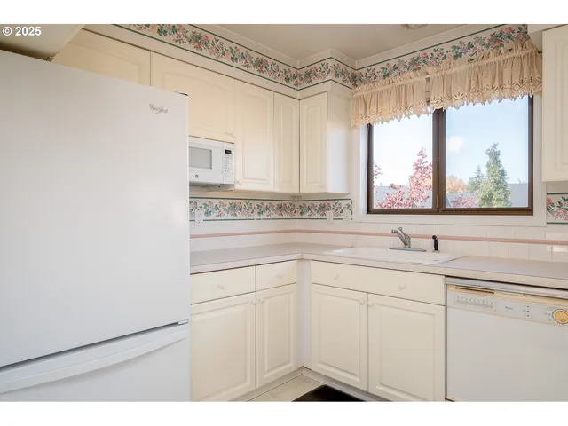 a kitchen with a sink and a window