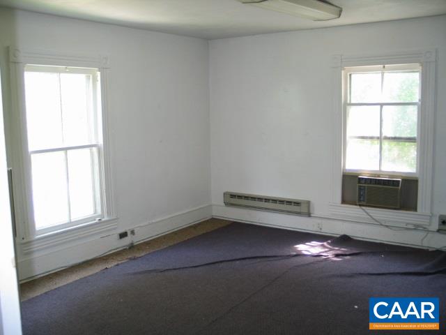 22 Shiloh Road, Unit 2 Stanardsville, VA 22973 - Photo 18 of 22 an empty room with a fireplace