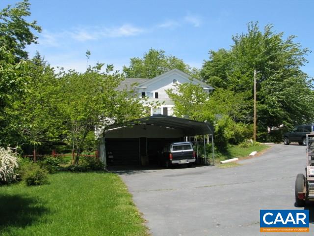 22 Shiloh Road, Unit 2 Stanardsville, VA 22973 - Photo 4 of 22 a front view of a house with a yard and garage