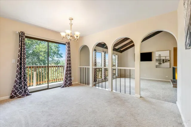 a view of livingroom with balcony