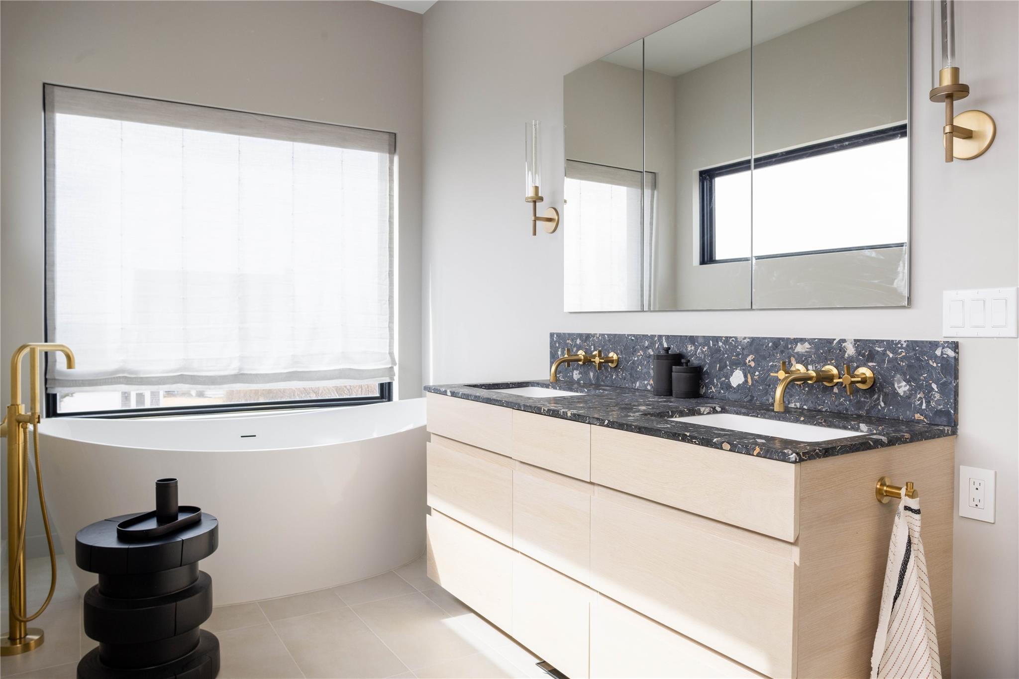 61 Peconic Avenue Shelter Island Heights, NY 11964 - Photo 11 of 27 a bathroom with a sink and a mirror