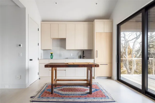 a room with furniture a rug and a window