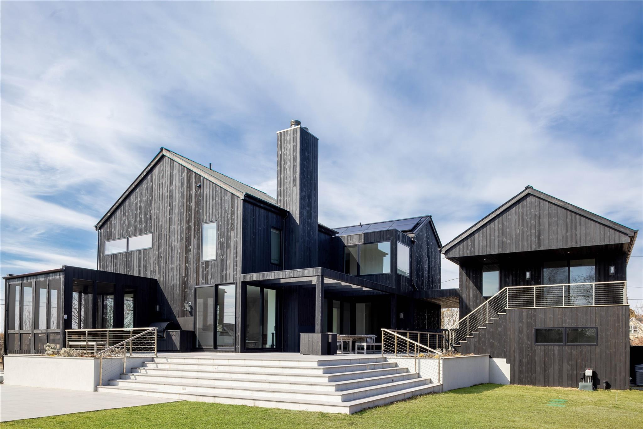 61 Peconic Avenue Shelter Island Heights, NY 11964 - Photo 27 of 27 a view of house with yard and staircase