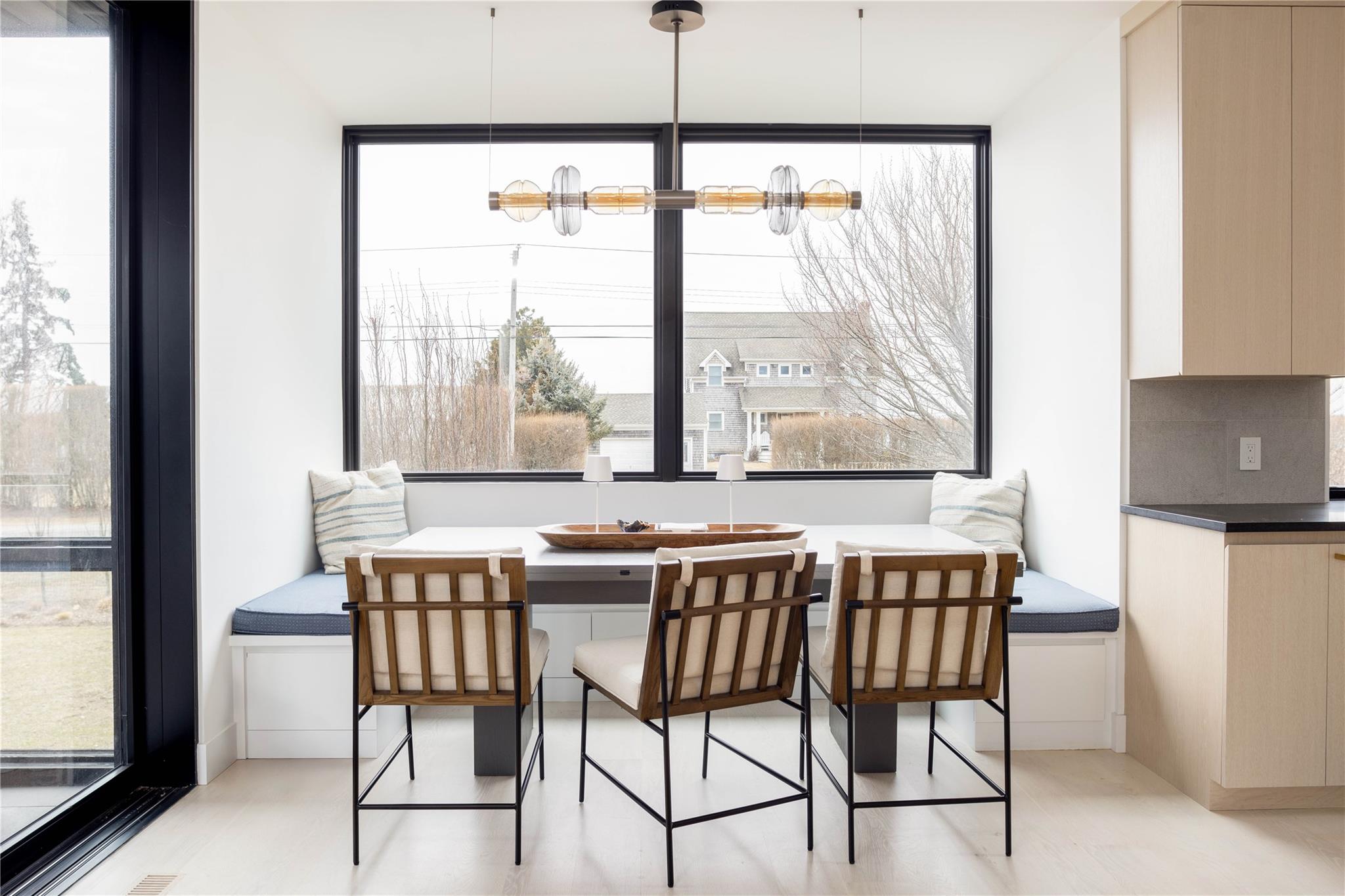 61 Peconic Avenue Shelter Island Heights, NY 11964 - Photo 5 of 27 a dining room with furniture and window