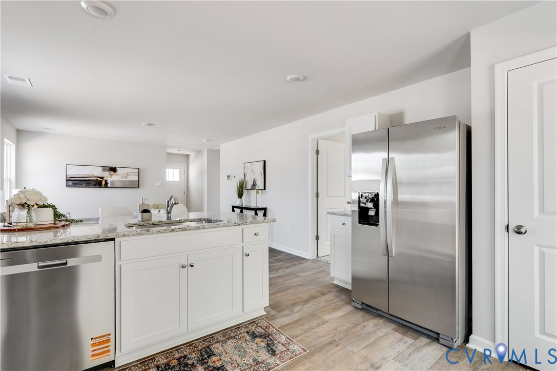 101 Our Way Drive Kilmarnock, VA 22482 - Photo 18 of 38 a kitchen with stainless steel appliances granite countertop a refrigerator and a sink