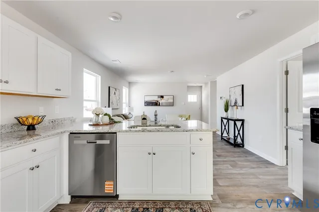 a kitchen with a sink and cabinets