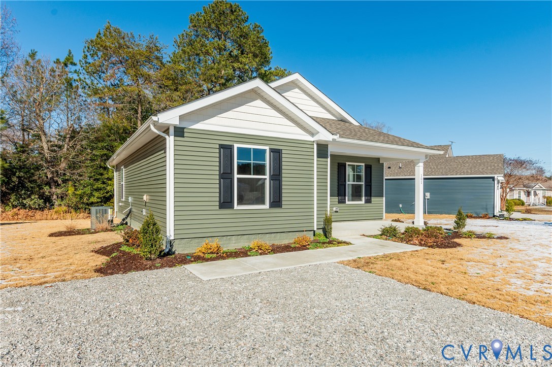 101 Our Way Drive Kilmarnock, VA 22482 - Photo 2 of 38 a front view of a house with a yard and seating space
