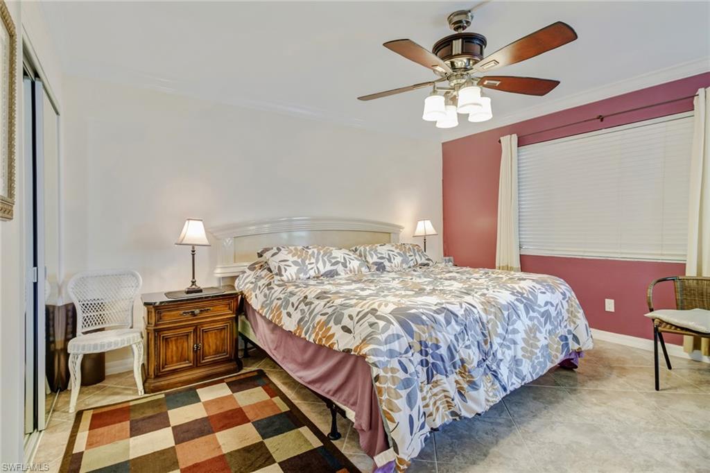 49 High Point Circle South, Unit 102 Naples, FL 34103 - Photo 15 of 42 Master bedroom with ensuite