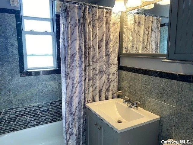 a bathroom with a sink and vanity