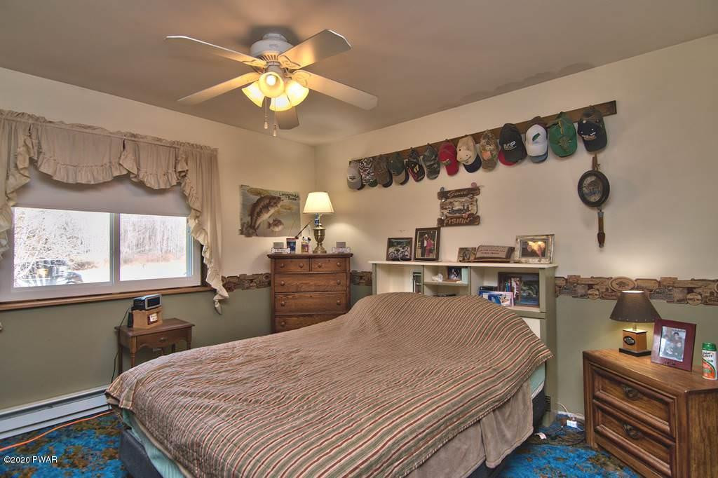 682 Stock Farm Road Lake Ariel, PA 18436 - Photo 37 of 78 a bed room with a bed and a television