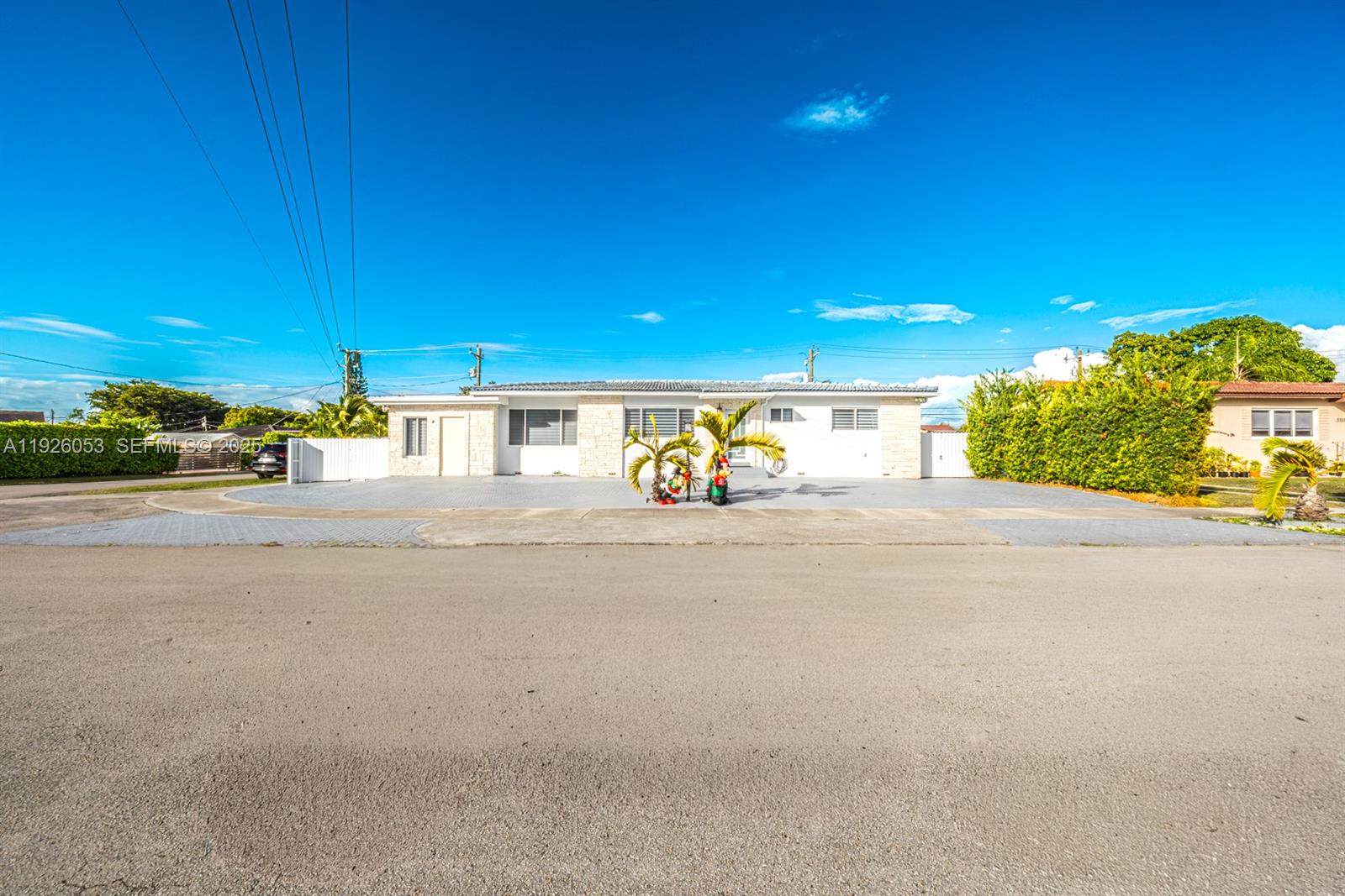 9365 Southwest 44th Street Miami, FL 33165 - Photo 1 of 24 a view of a street with an empty room