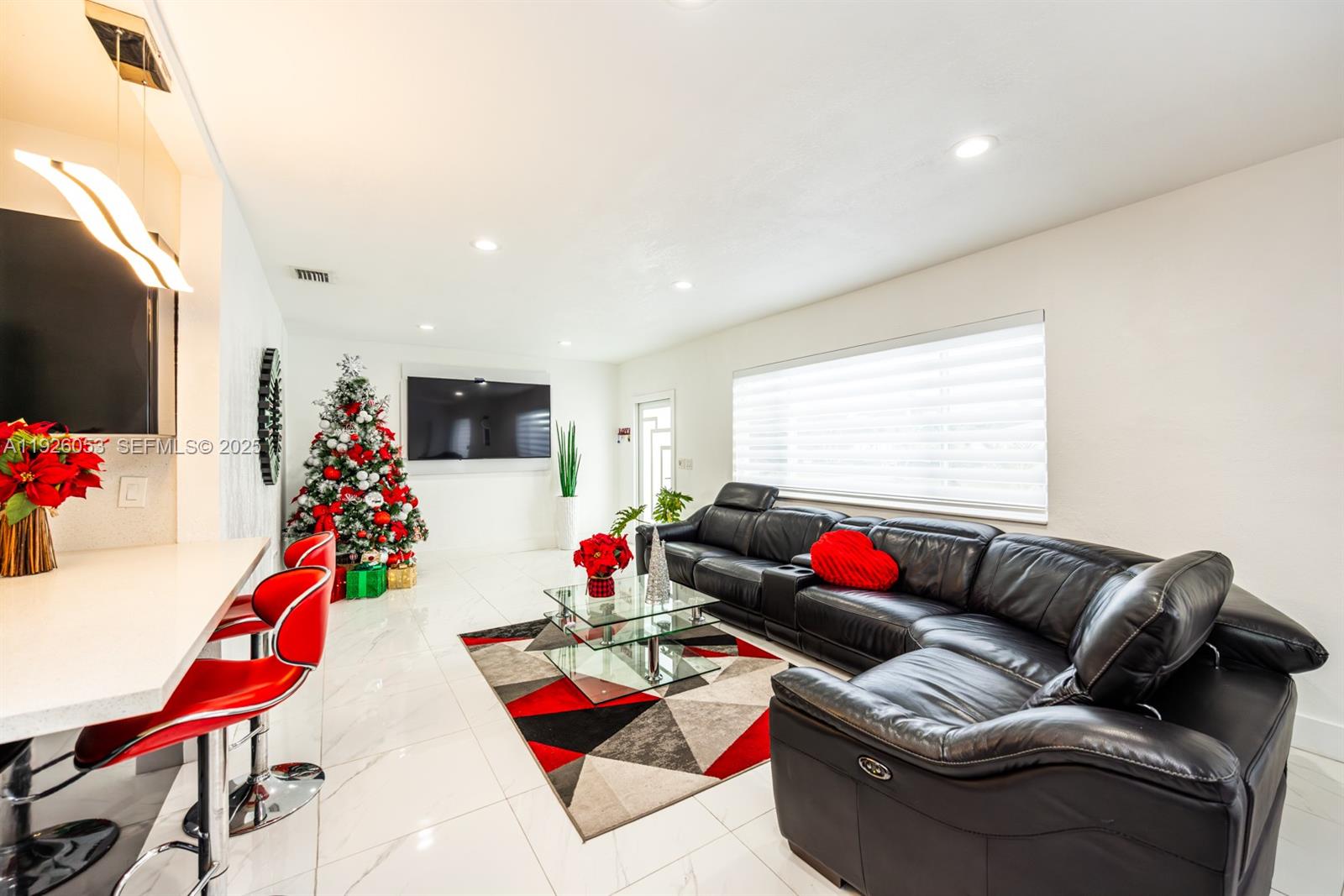 9365 Southwest 44th Street Miami, FL 33165 - Photo 12 of 24 a living room with furniture and flat screen tv