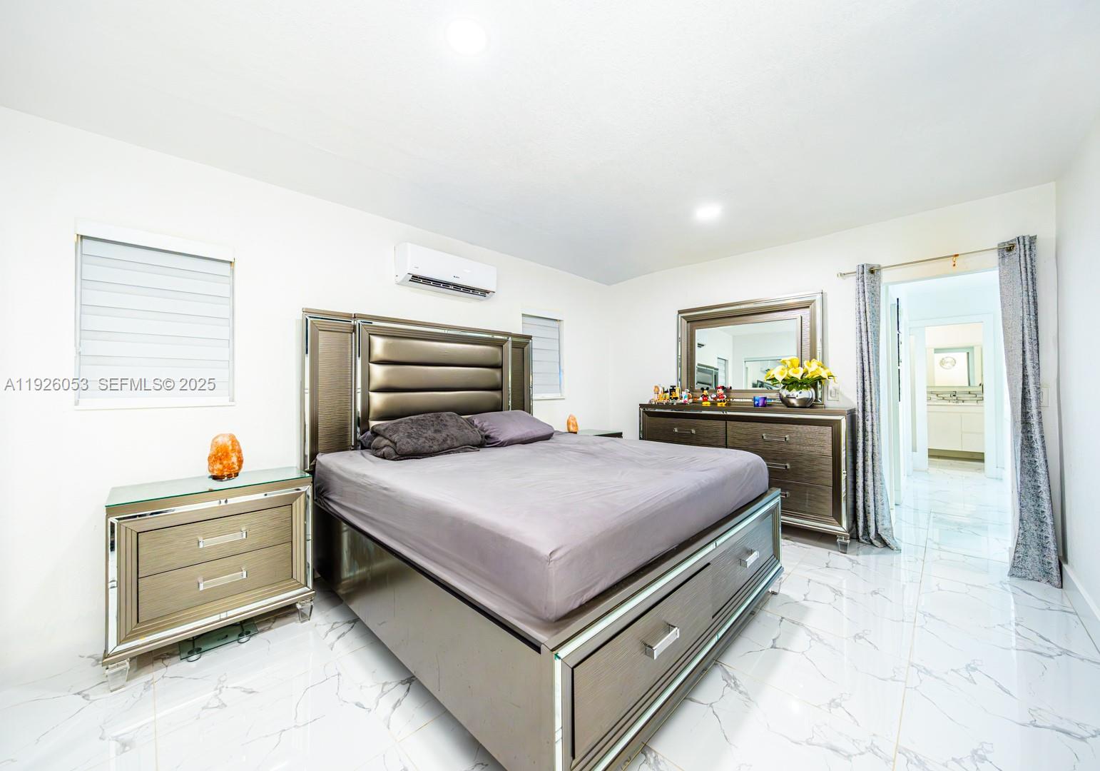 9365 Southwest 44th Street Miami, FL 33165 - Photo 15 of 24 a bedroom with a bed and a closet