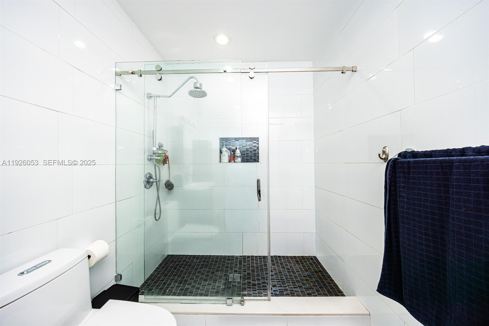 9365 Southwest 44th Street Miami, FL 33165 - Photo 20 of 24 a bathroom with a shower