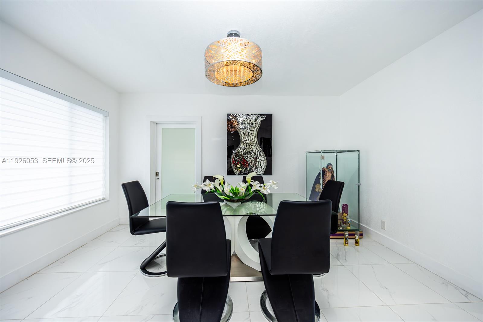 9365 Southwest 44th Street Miami, FL 33165 - Photo 8 of 24 a dining room with furniture and a window