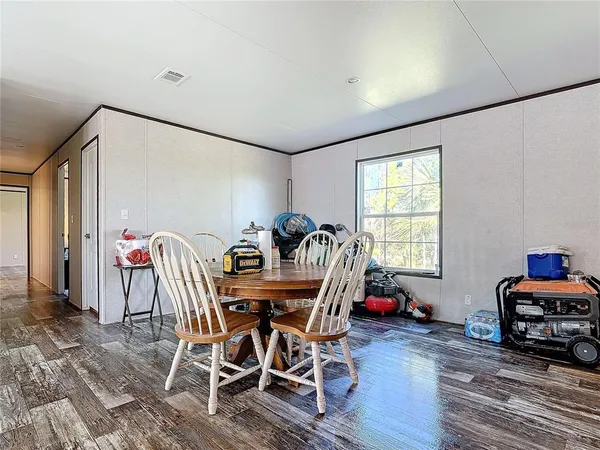 a kitchen with granite countertop a sink stove top oven and cabinets