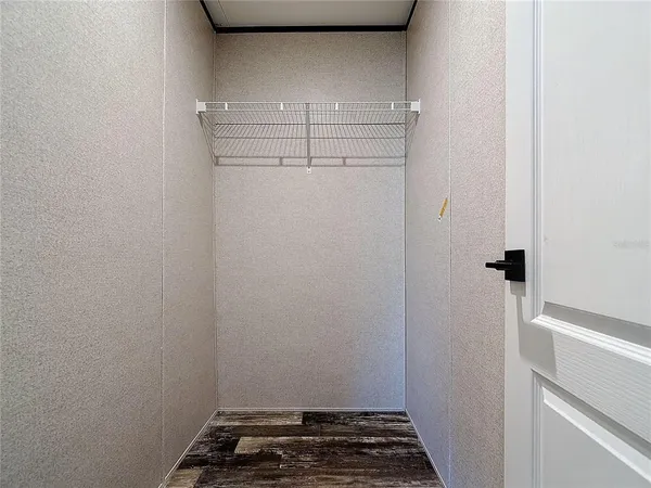 a bed room with a bed and a desk