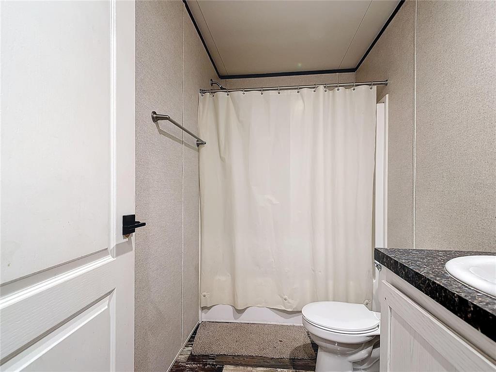 8325 Strasse Boulevard Punta Gorda, FL 33982 - Photo 34 of 57 a bathroom with a granite countertop bathtub sink and toilet