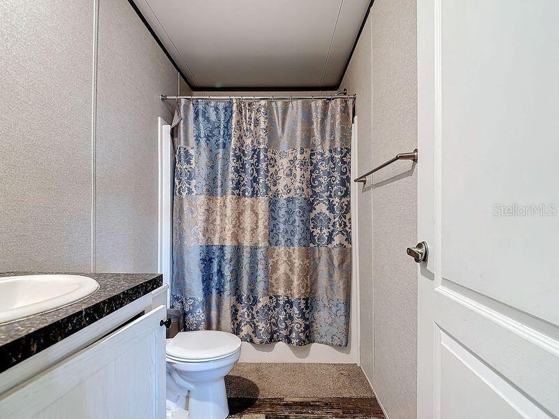8325 Strasse Boulevard Punta Gorda, FL 33982 - Photo 45 of 57 a bathroom with a granite countertop sink toilet and shower