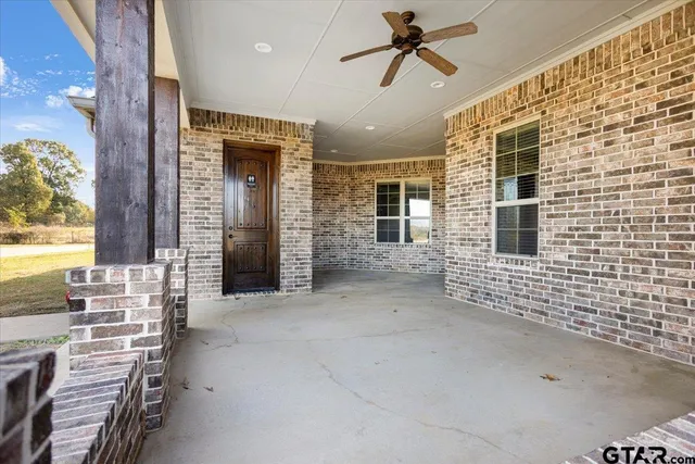 a view of a small house with swimming pool