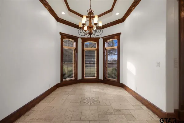 a view of an entryway with a chandelier