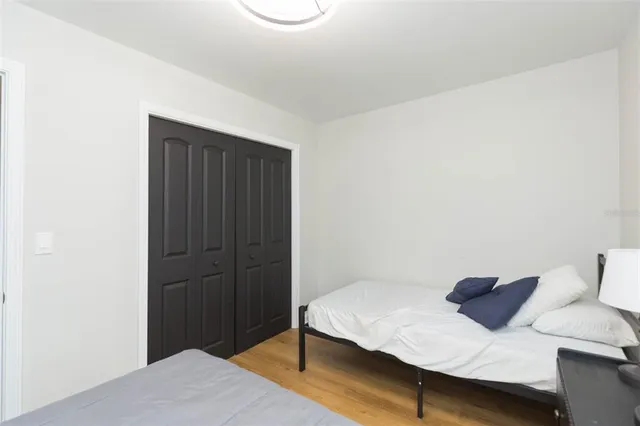 a bedroom with a bed and a dresser