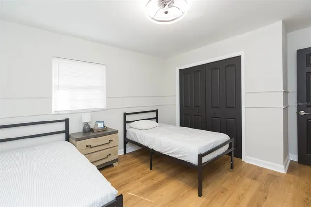 a bedroom with a bed and a table