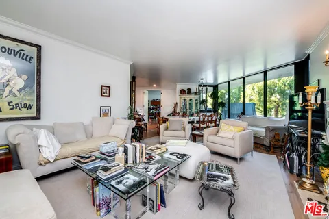 a large kitchen with a table and chairs