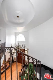 a view of a balcony with wooden fence