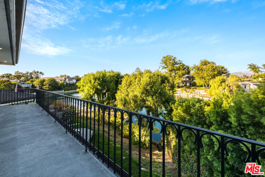 10061 Valley Spring Lane Toluca Lake, CA 91602 - Photo 18 of 37 a view of a balcony with wooden fence