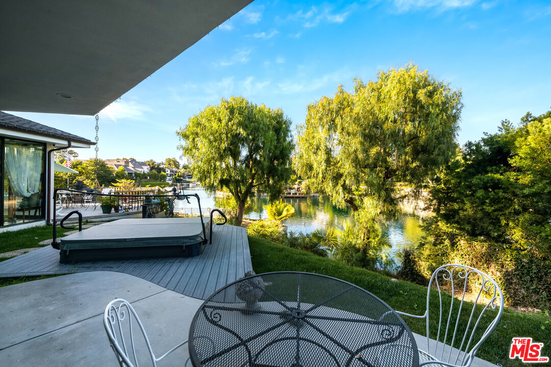 10061 Valley Spring Lane Toluca Lake, CA 91602 - Photo 25 of 37 a view of a swimming pool with a patio