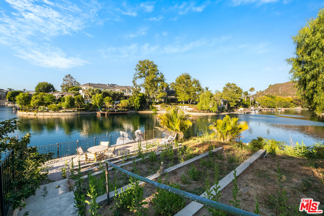 10061 Valley Spring Lane Toluca Lake, CA 91602 - Photo 30 of 37 a view of a lake with outdoor space