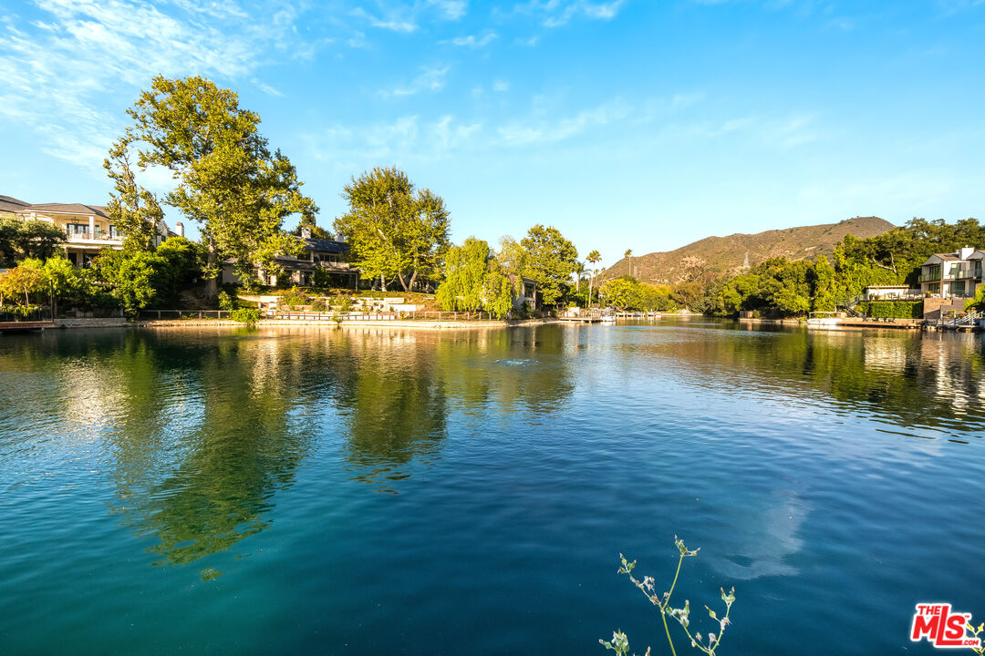 10061 Valley Spring Lane Toluca Lake, CA 91602 - Photo 33 of 37 a view of a lake with houses