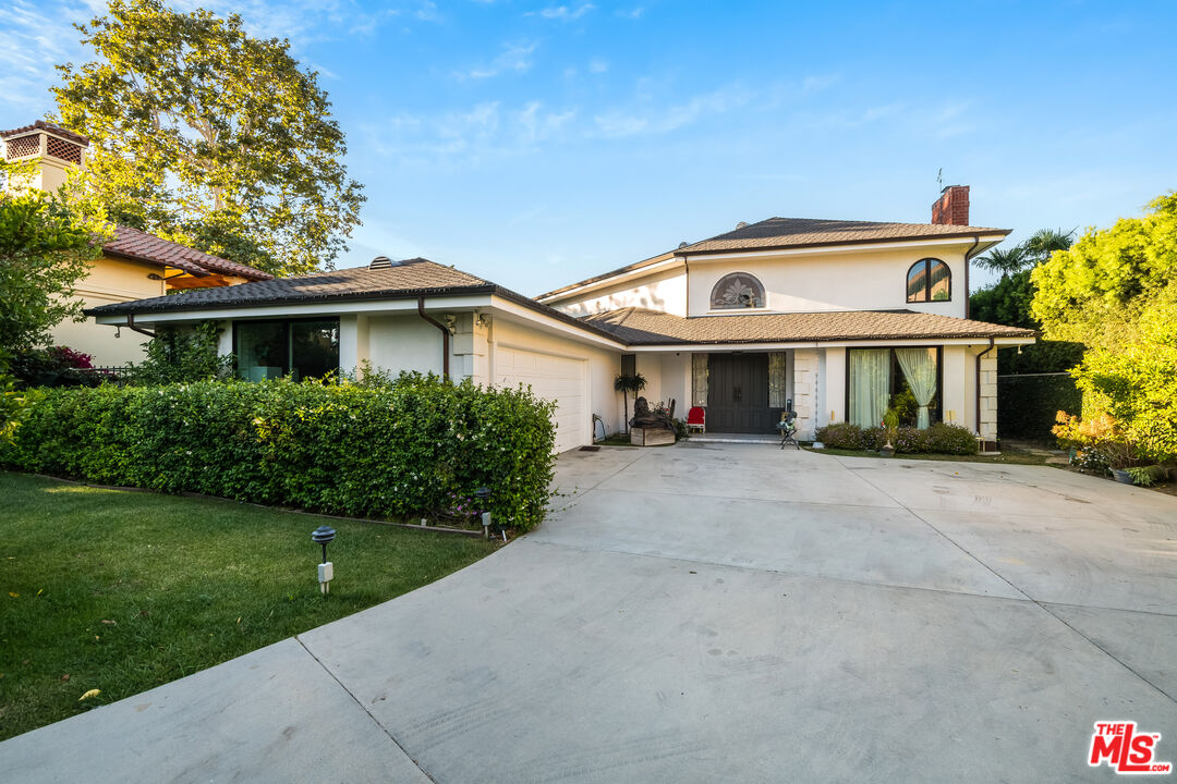 10061 Valley Spring Lane Toluca Lake, CA 91602 - Photo 37 of 37 a front view of a house with a yard