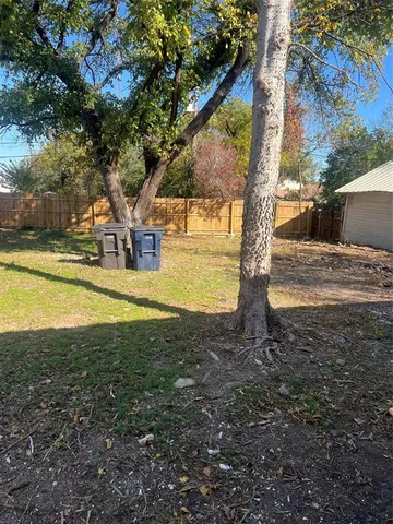 a view of a yard with swimming pool