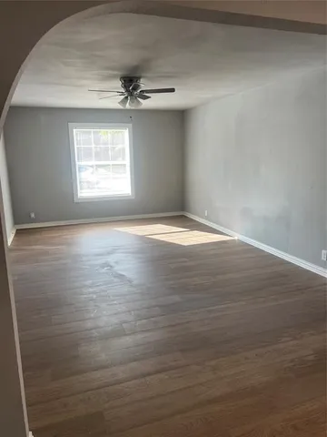 a view of an empty room with a window