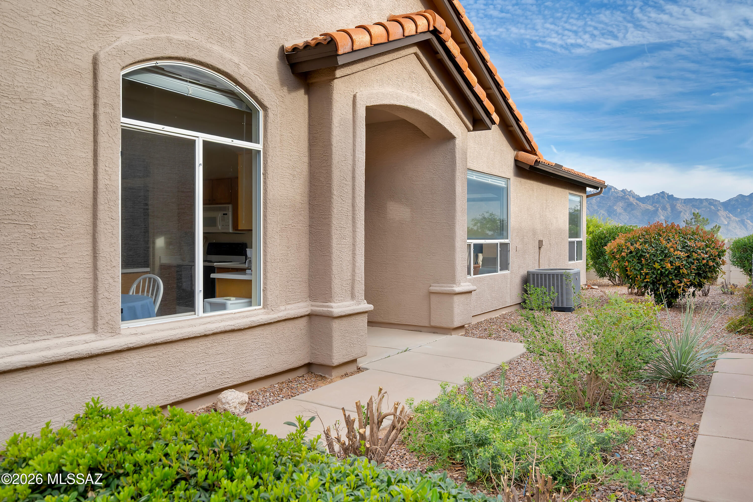 64351 East Wind Ridge Circle Tucson, AZ 85739 - Photo 4 of 41 front view of a house with a yard