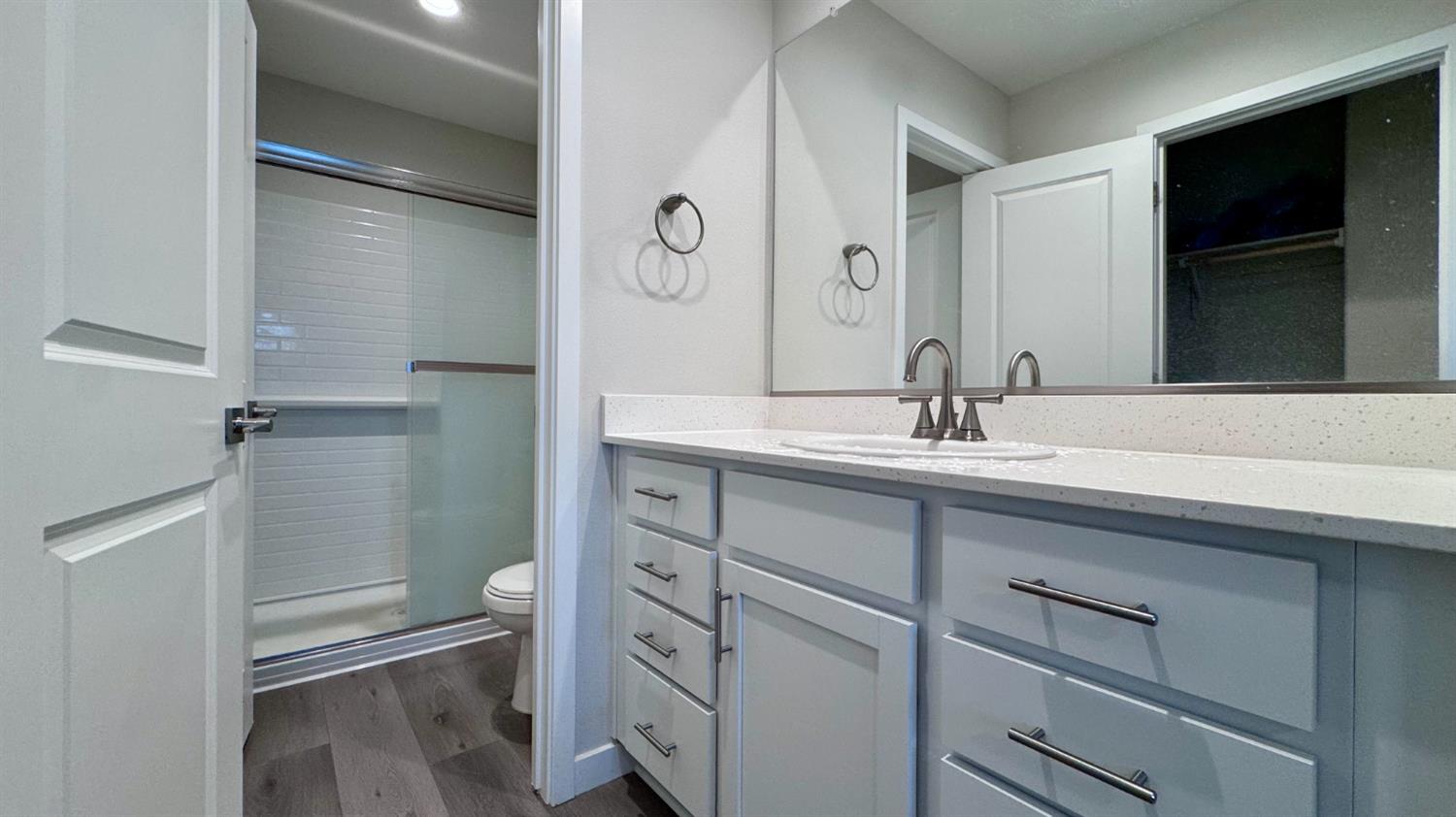 4163 Vincent Road Madera, CA 93636 - Photo 14 of 17 a bathroom with a sink and a mirror