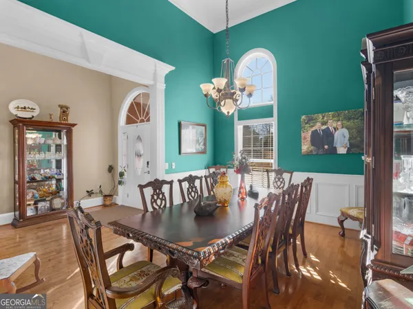 a view of a livingroom with furniture and a chandelier