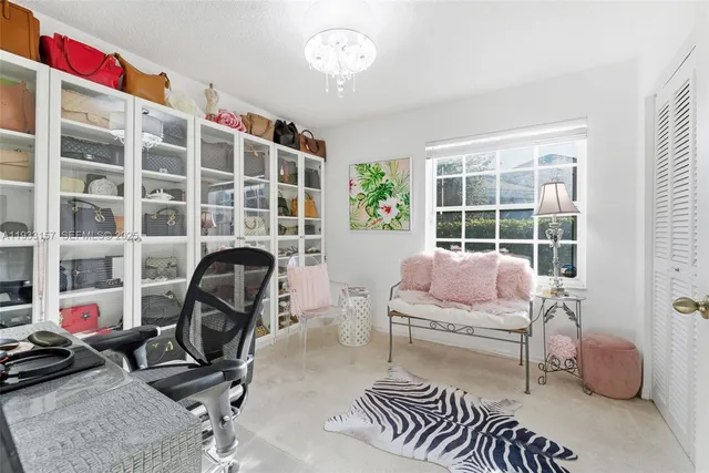 a bedroom with furniture and a window