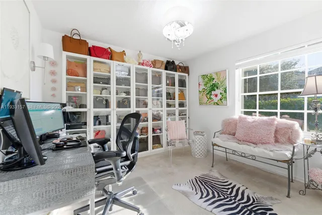 a bedroom with furniture and a window