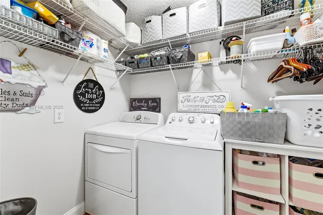 a utility room with dryer and washer