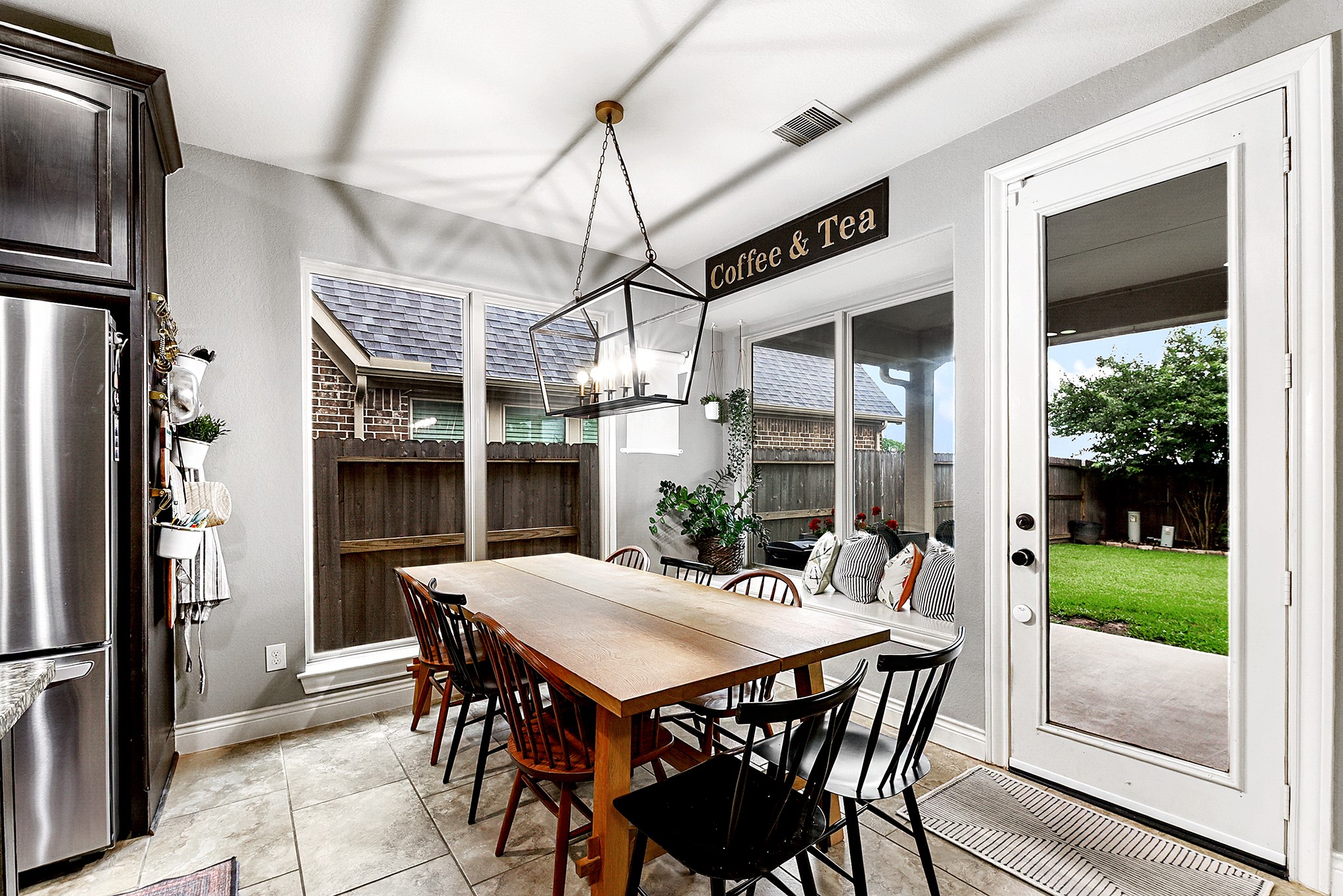 2939 Bobby Jones Road Katy, TX 77494 - Photo 19 of 50 a view of a dining table and chairs in porch