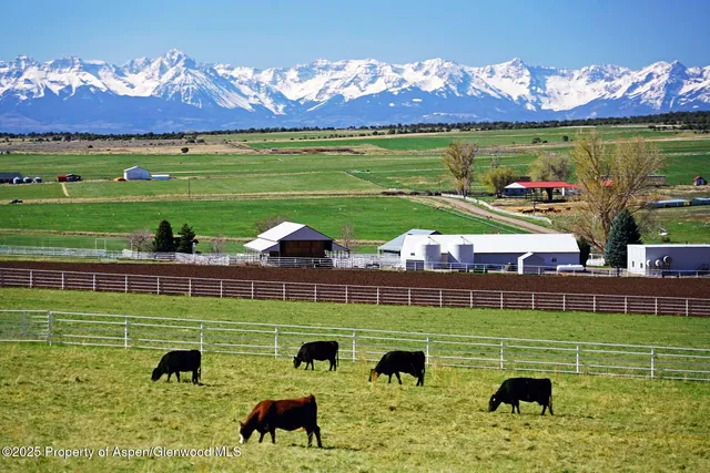 a view of a golf course with a house
