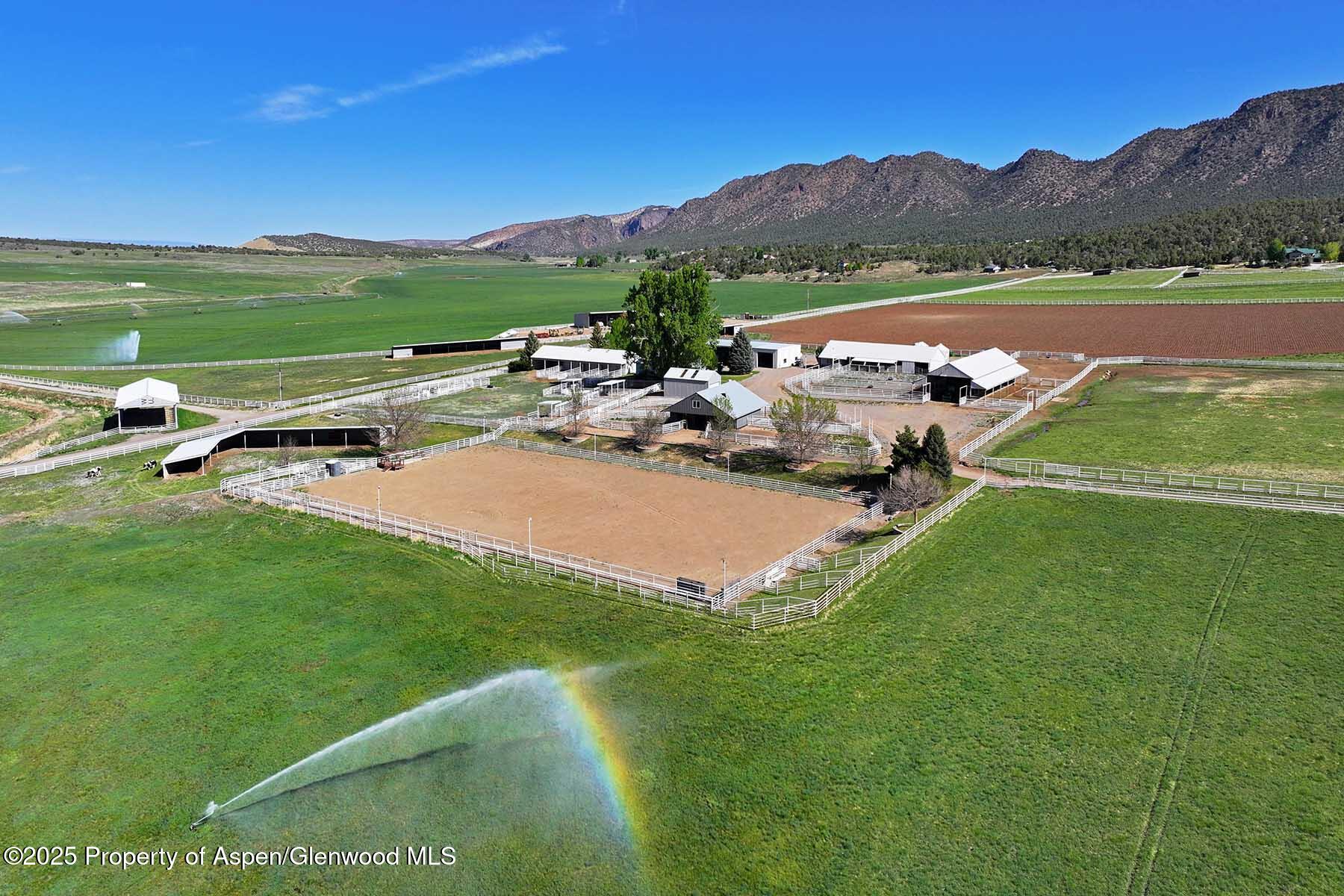10676 Bostwick Park Road Montrose, CO 81401 - Photo 6 of 42 a view of a lake with a mountain in the background