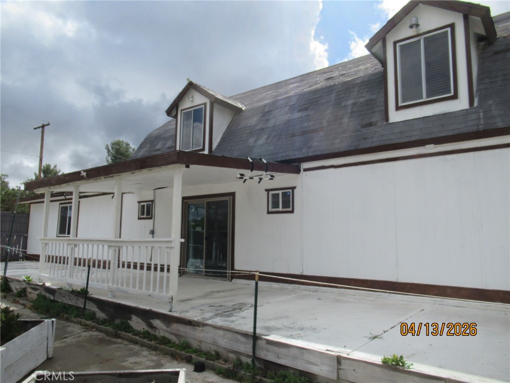 a view of a house with a garage and deck